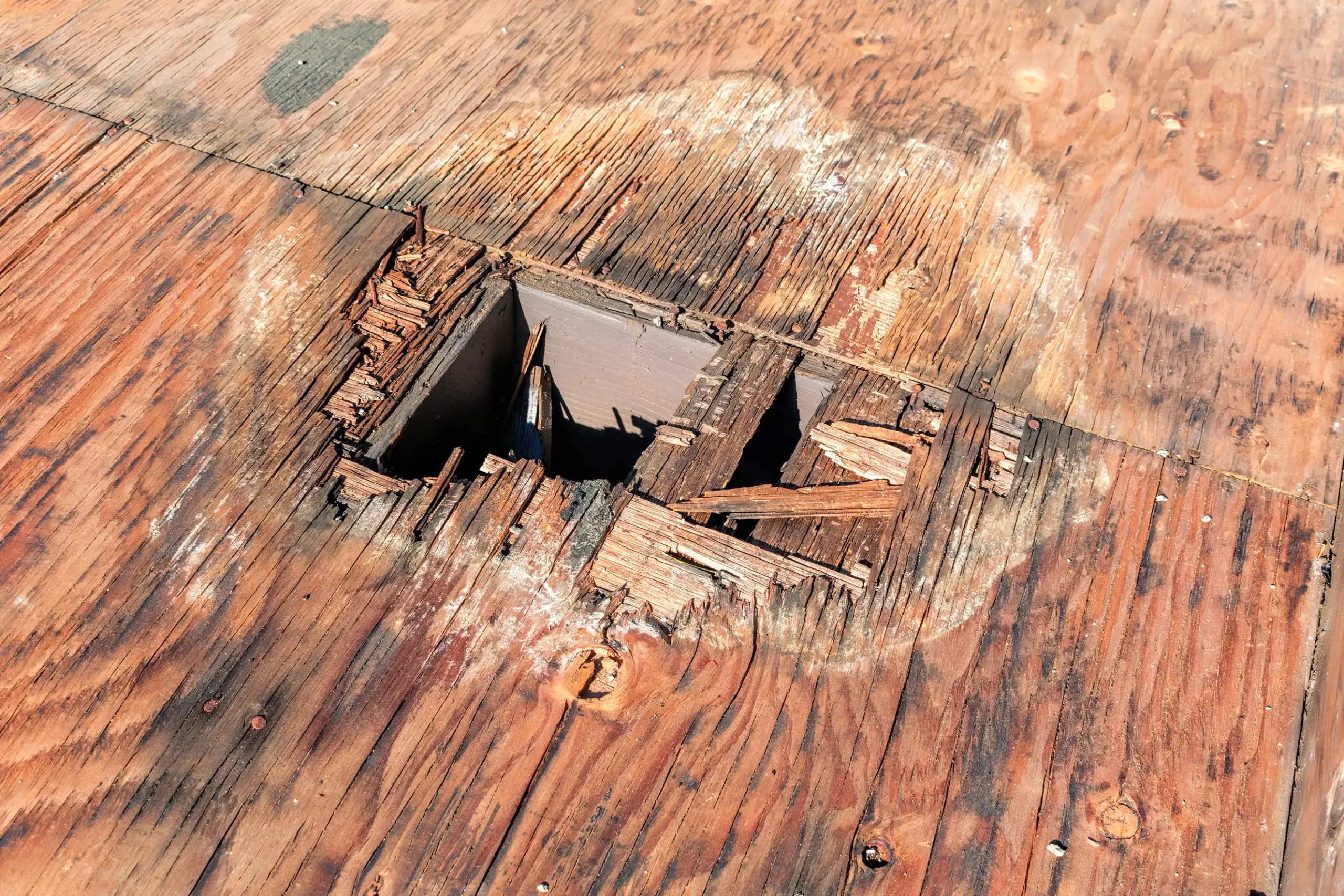 Rotted roof decking discovered during tear-off requiring supplement documentation